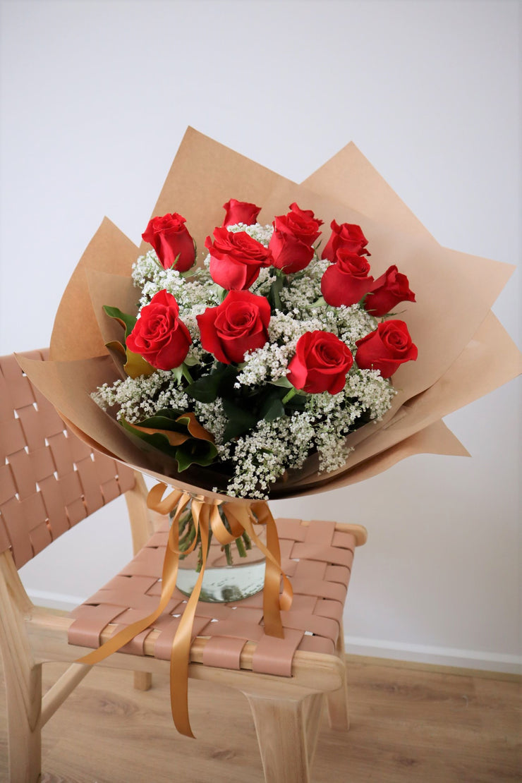 A bouquet of red roses waiting for delivery on Valentine&